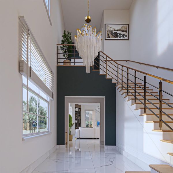 Step into a grand, light-filled two-story entry featuring soaring ceilings and an impressive open staircase design.