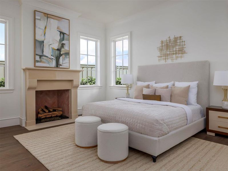 Bedroom featuring wood finished floors and a fireplace with flush hearth Bedroom featuring wood finished floors and a fireplace with flush hearth