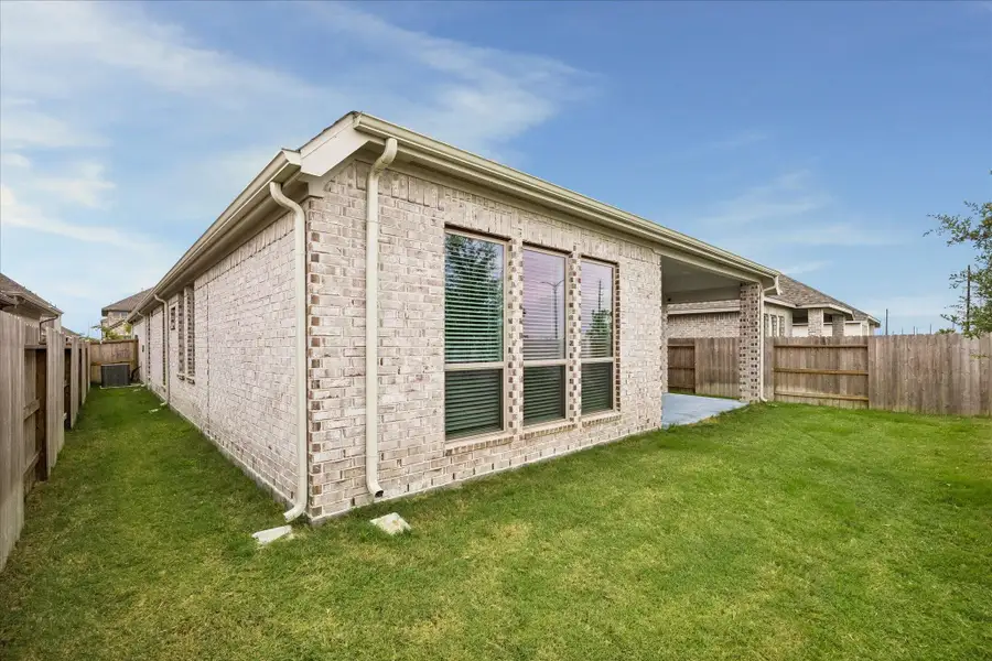 Exterior details and patio area of a home in Valencia, Manvel (Image 3). Exterior details and patio area of a home in Valencia, Manvel (Image 3).