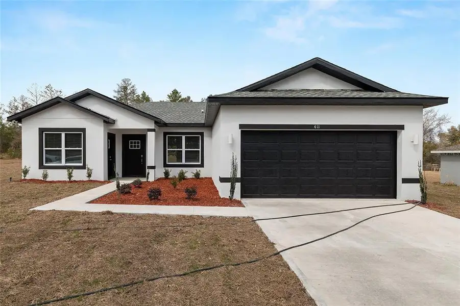 Front exterior of a new home in , Ocala, FL, highlighting curb appeal (Image 27). Front exterior of a new home in , Ocala, FL, highlighting curb appeal (Image 27).