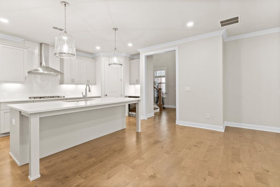 Representative furnished interior of a home built from the The McIntosh by The Providence Group in Promenade at Sawnee Village, Cumming (Image 5).