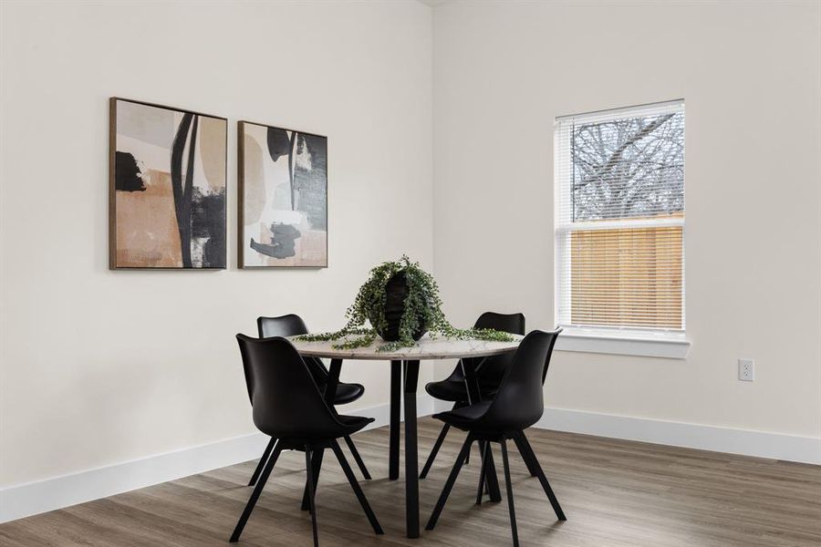 Dining room with wood-type flooring