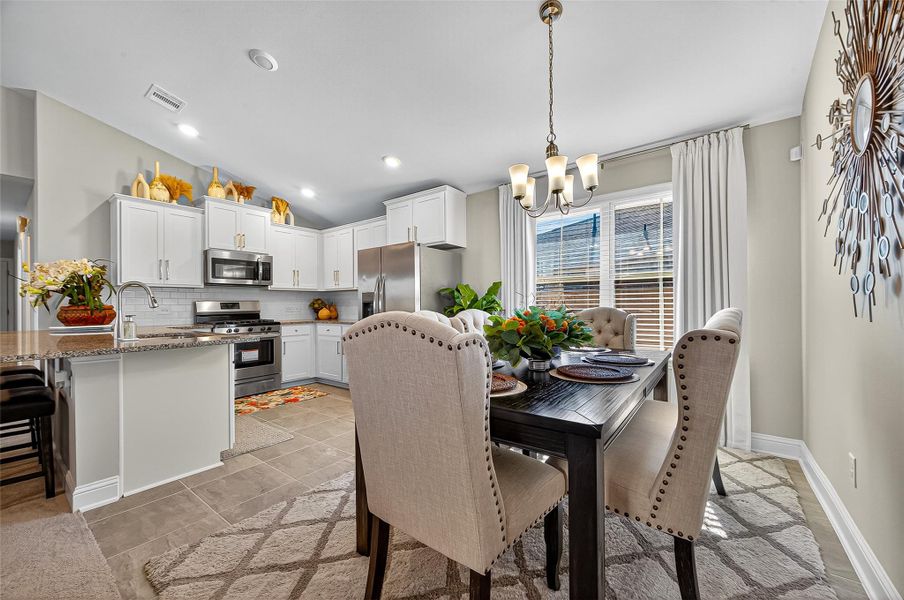 Furnished interior view inside a new home in Sunterra, Katy (Image 14).