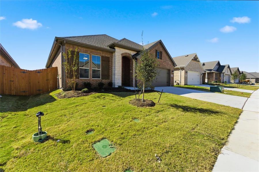 Front exterior of a new home in Northstar, Haslet, TX, highlighting curb appeal (Image 20).