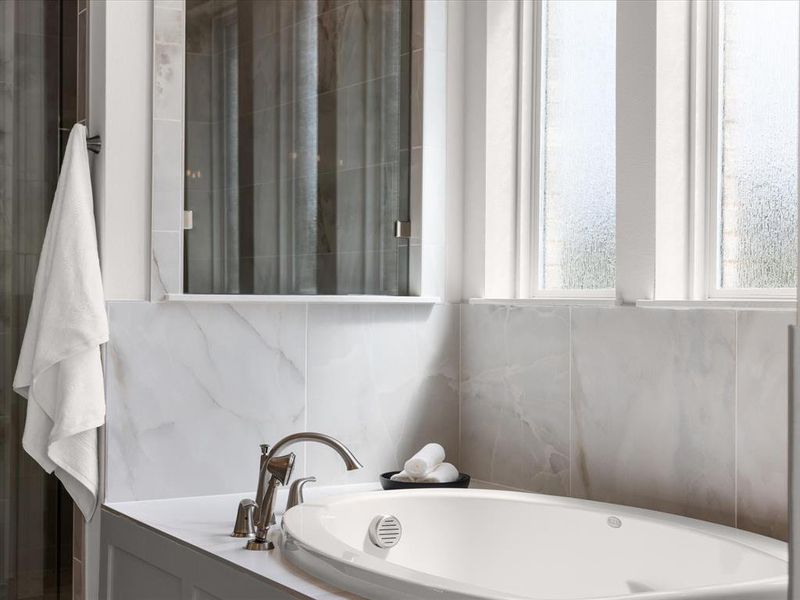 Full bathroom featuring a garden tub