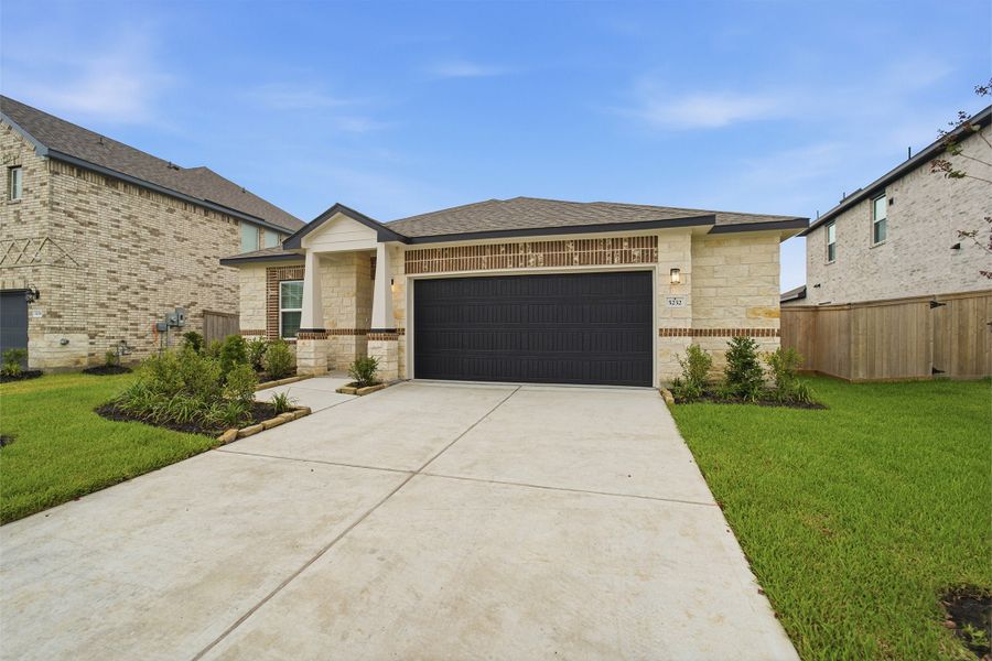 Front exterior of a new home in Massey Oaks, Pearland, TX, highlighting curb appeal (Image 19).