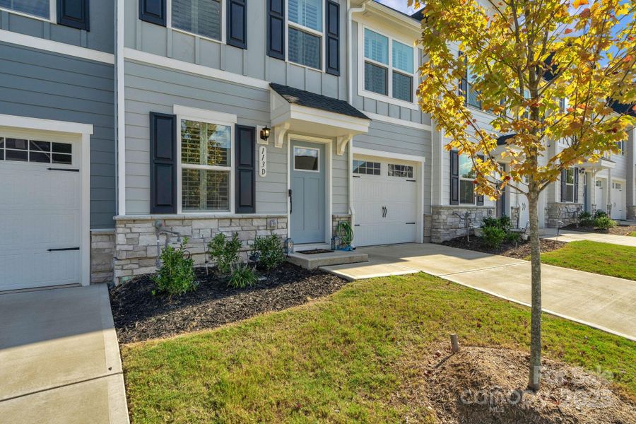 Front exterior of a new home in , Troutman, NC, highlighting curb appeal (Image 21).