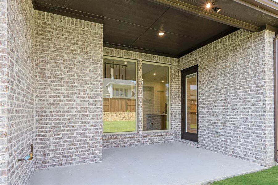 Exterior details and patio area of a home in Windsong Ranch Classic 61, Prosper (Image 4). Exterior details and patio area of a home in Windsong Ranch Classic 61, Prosper (Image 4).