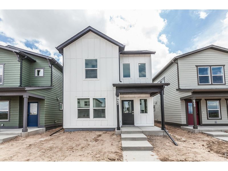 Front exterior of a new home in Prairie Song Cottages, Windsor, CO, highlighting curb appeal (Image 2). Front exterior of a new home in Prairie Song Cottages, Windsor, CO, highlighting curb appeal (Image 2).