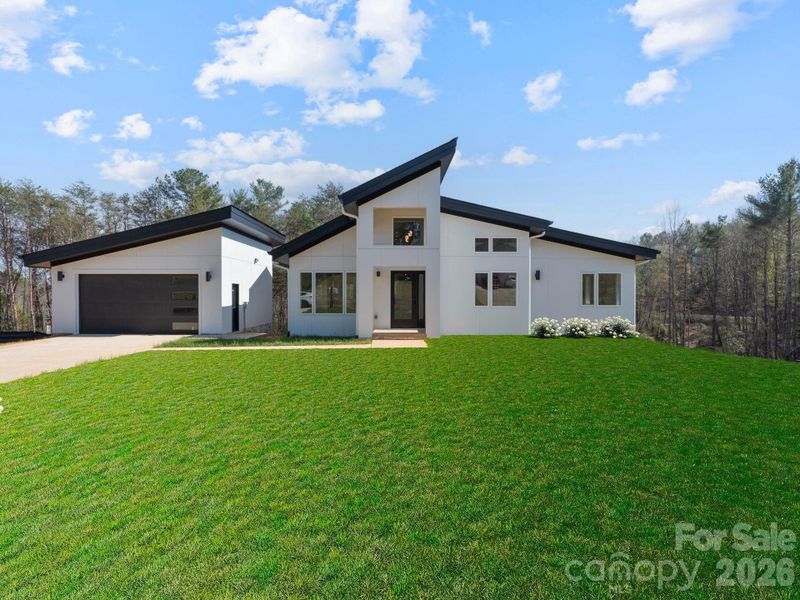 Front exterior of a new home in , Hickory, NC, highlighting curb appeal (Image 22).