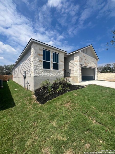 Front exterior of a new home in Weston Oaks, San Antonio, TX, highlighting curb appeal (Image 2). Front exterior of a new home in Weston Oaks, San Antonio, TX, highlighting curb appeal (Image 2).