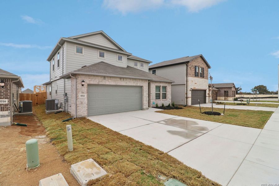 Front exterior of a new home in Legendary Trails - Premier Series, Cibolo, TX, highlighting curb appeal (Image 23).
