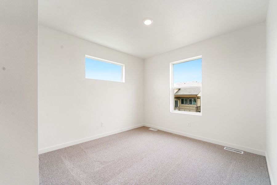 Spacious, unfurnished interior of a new home in Union Colony West, Greeley (Image 12).