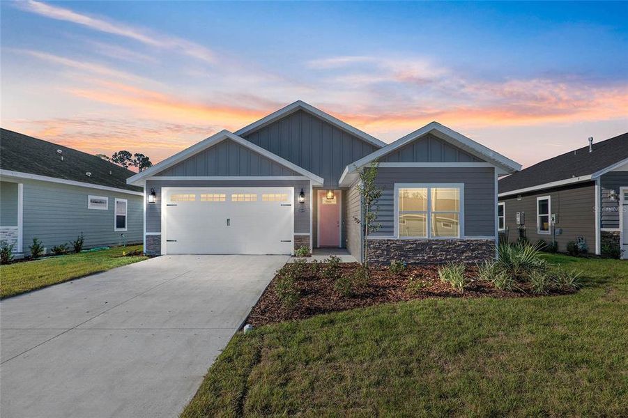 Front exterior of a new home in , Gainesville, FL, highlighting curb appeal (Image 1). Front exterior of a new home in , Gainesville, FL, highlighting curb appeal (Image 1).