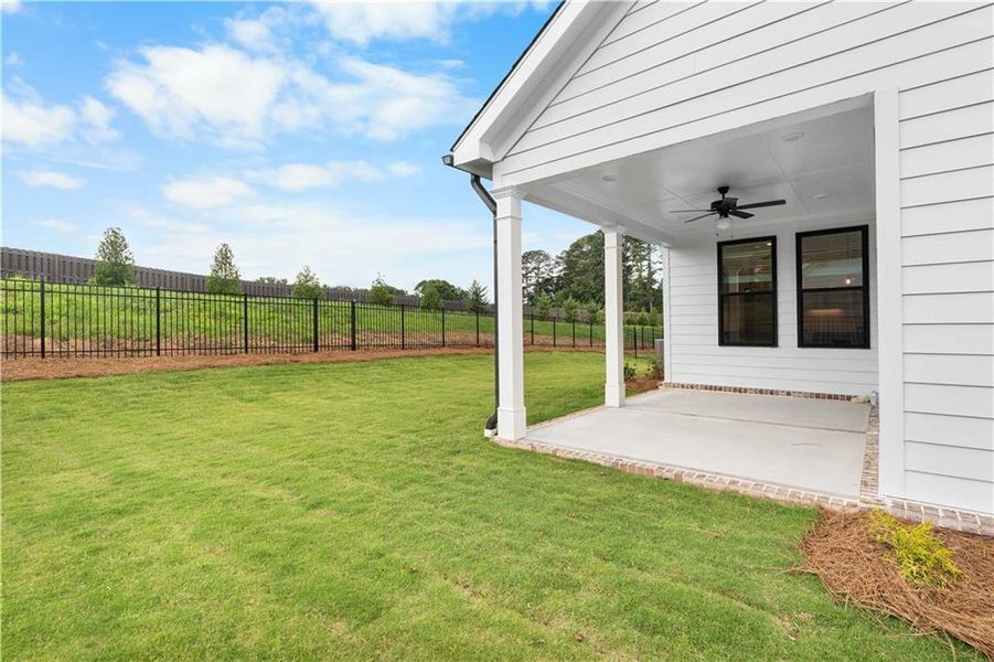 Exterior details and patio area of a home in Promenade at Sawnee Village, Cumming (Image 27).