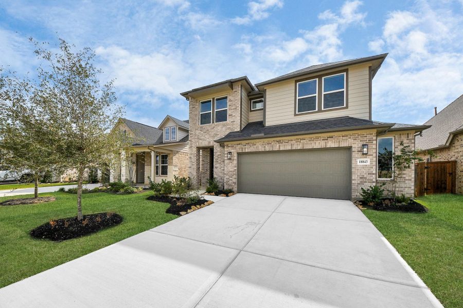 Front exterior of a new home in Amira: Premier Collection, Tomball, TX, highlighting curb appeal (Image 1).