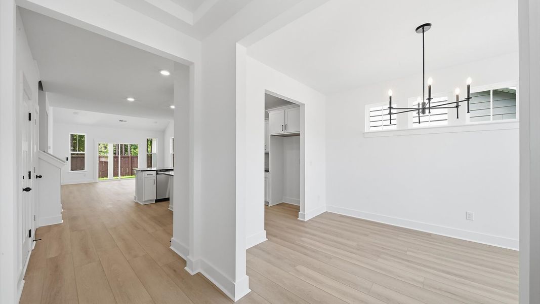 Exceptional foyer with warm hardwood flooring and refined finishes throughout Exceptional foyer with warm hardwood flooring and refined finishes throughout