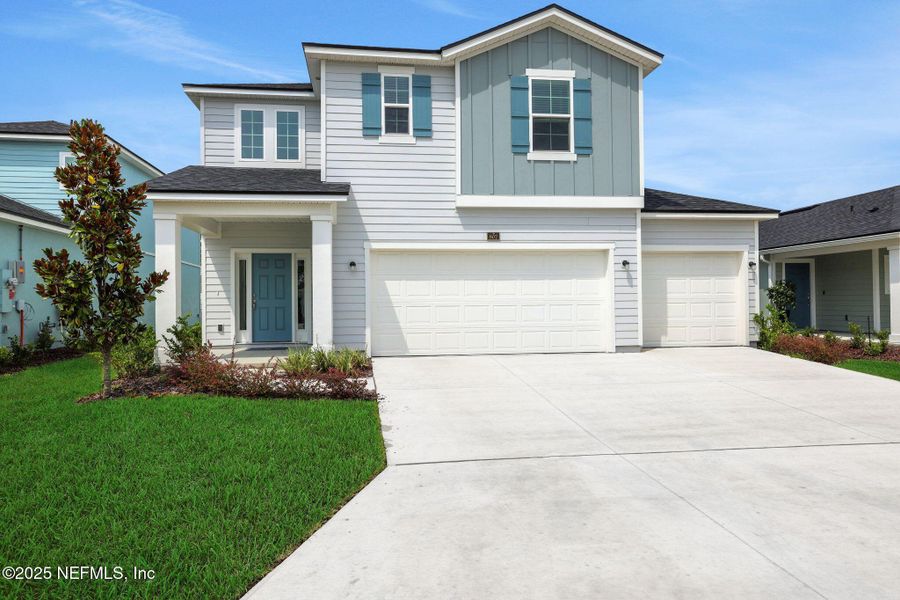 Front exterior of a new home in Cordova Palms, St. Augustine, FL, highlighting curb appeal (Image 16).