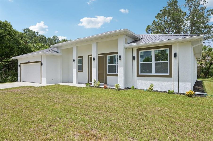 Front exterior of a new home in , North Port, FL, highlighting curb appeal (Image 19).