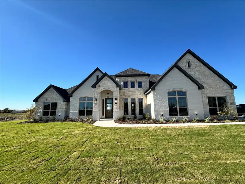 Front exterior of a new home in , Decatur, TX, highlighting curb appeal (Image 2). Front exterior of a new home in , Decatur, TX, highlighting curb appeal (Image 2).