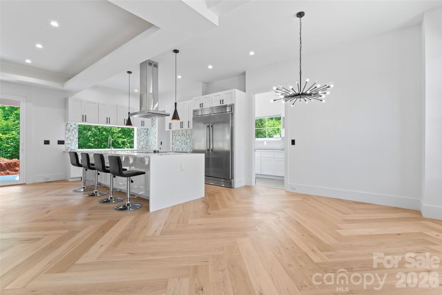 Open floor concept with breakfast, den and kitchen