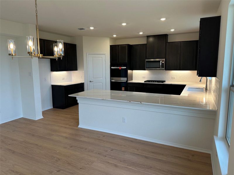 Furnished interior view inside a new home in Salerno - Classic Collection, Round Rock (Image 5). Furnished interior view inside a new home in Salerno - Classic Collection, Round Rock (Image 5).