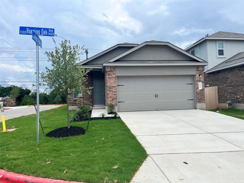 Front exterior of a new home in Woodfield Preserve: Ridgepointe Collection, Georgetown, TX, highlighting curb appeal (Image 2).