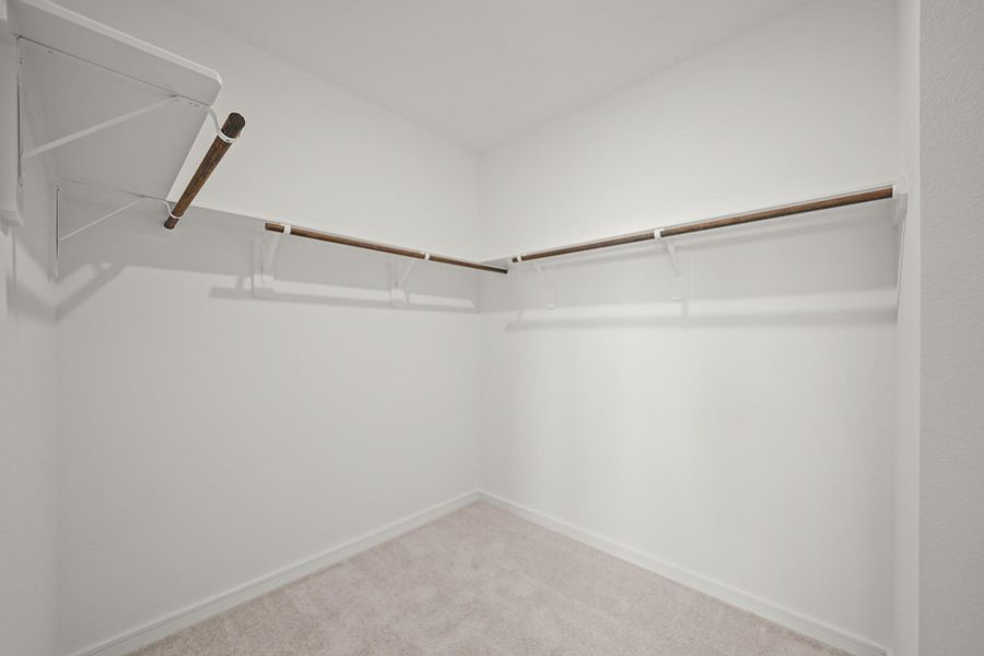 Walk-in closet in the primary suite (*Photo not of actual home and used for illustration purposes only.)