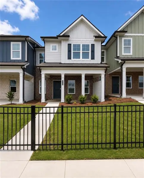 Front exterior of a new home in Lake Carlton, Loganville, GA, highlighting curb appeal (Image 1). Front exterior of a new home in Lake Carlton, Loganville, GA, highlighting curb appeal (Image 1).