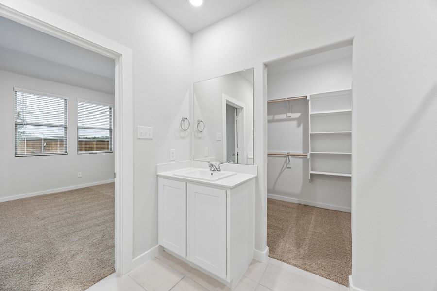 Primary Bathroom in the Cedar home plan by Trophy Signature Homes – REPRESENTATIVE PHOTO