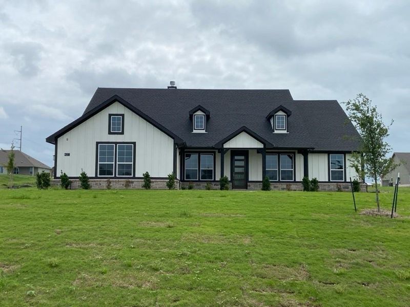 Front exterior of a new home in Hillview Addition, Decatur, TX, highlighting curb appeal (Image 11).