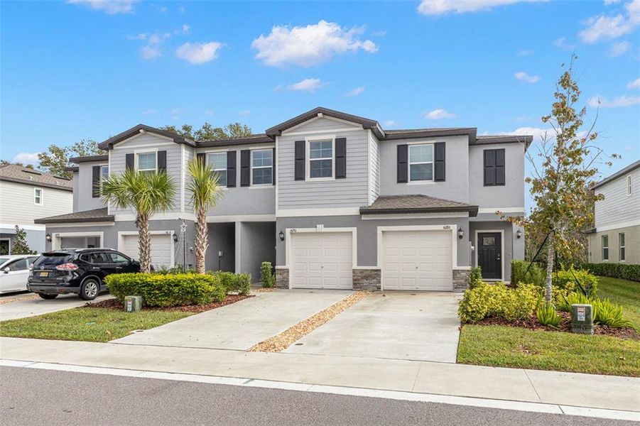 Front exterior of a new home in , Land O' Lakes, FL, highlighting curb appeal (Image 2). Front exterior of a new home in , Land O' Lakes, FL, highlighting curb appeal (Image 2).