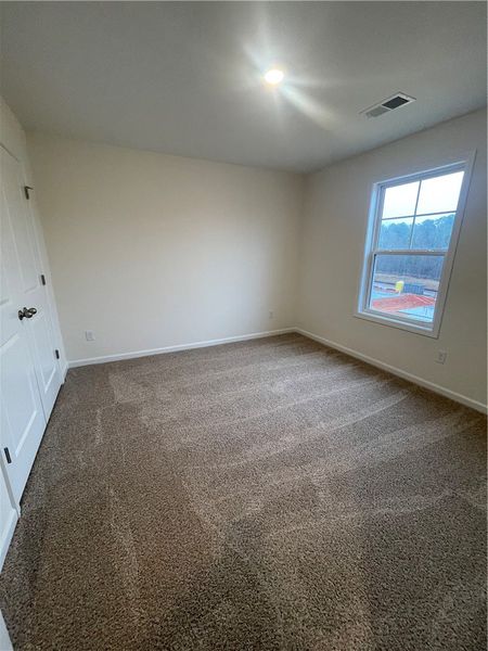 Spacious, unfurnished interior of a new home in Springwood Grove, Central (Image 20).