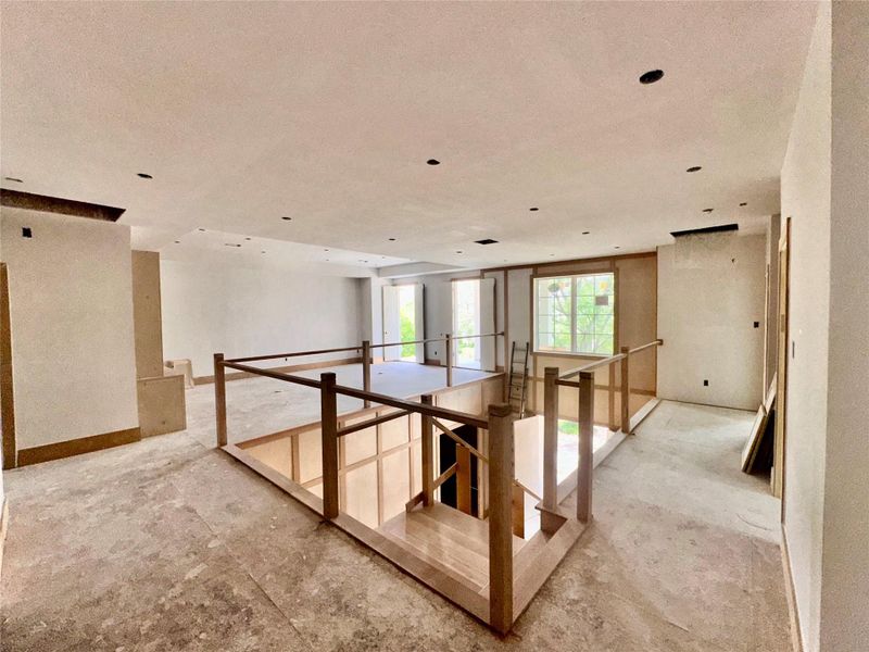 Another view of upstairs gallery and family room Another view of upstairs gallery and family room