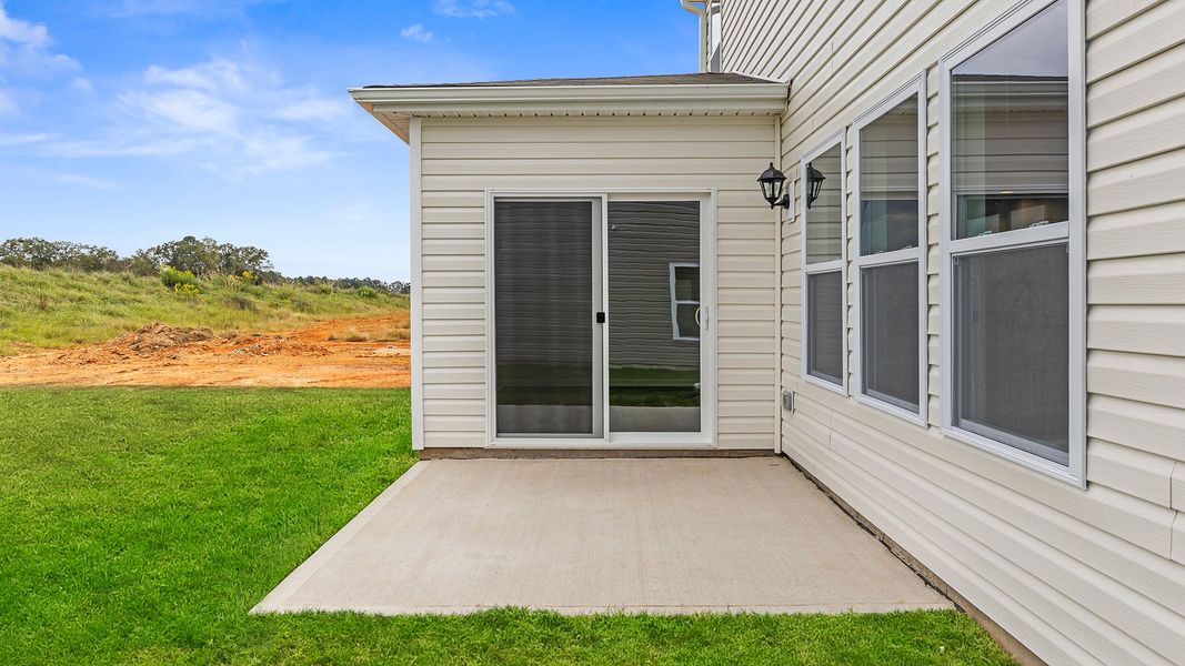 Exterior details and patio area of a home in Village Grove, Greenville (Image 3).