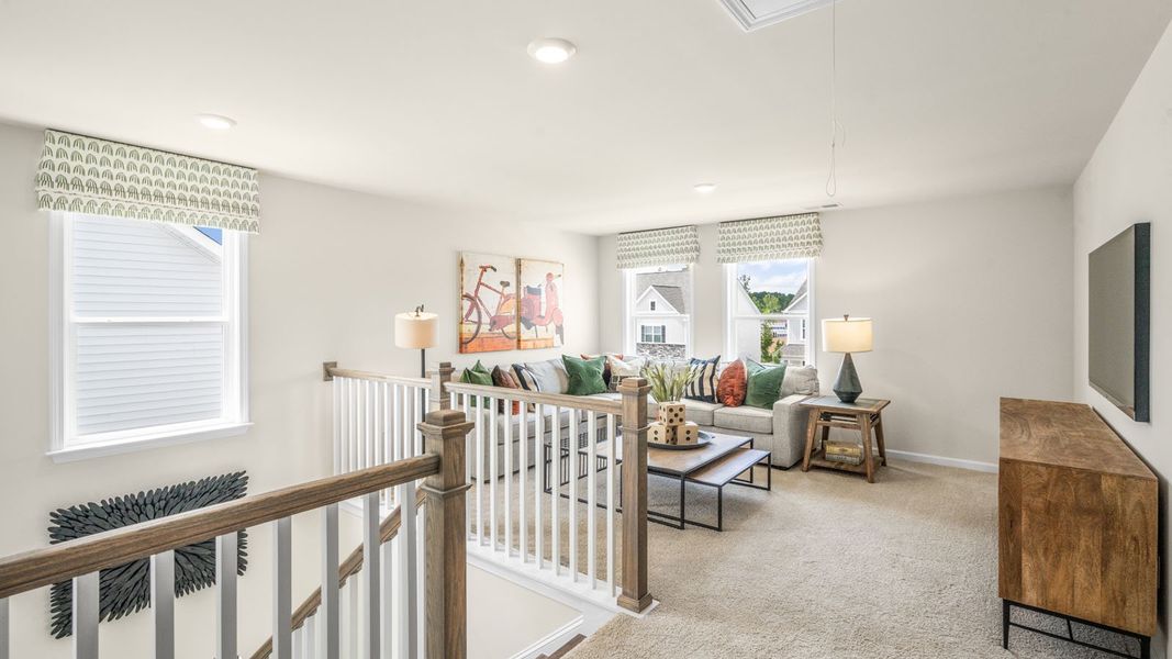 Representative furnished interior of a home built from the NORMAN by D.R. Horton in The Estates Park, Apex (Image 21).