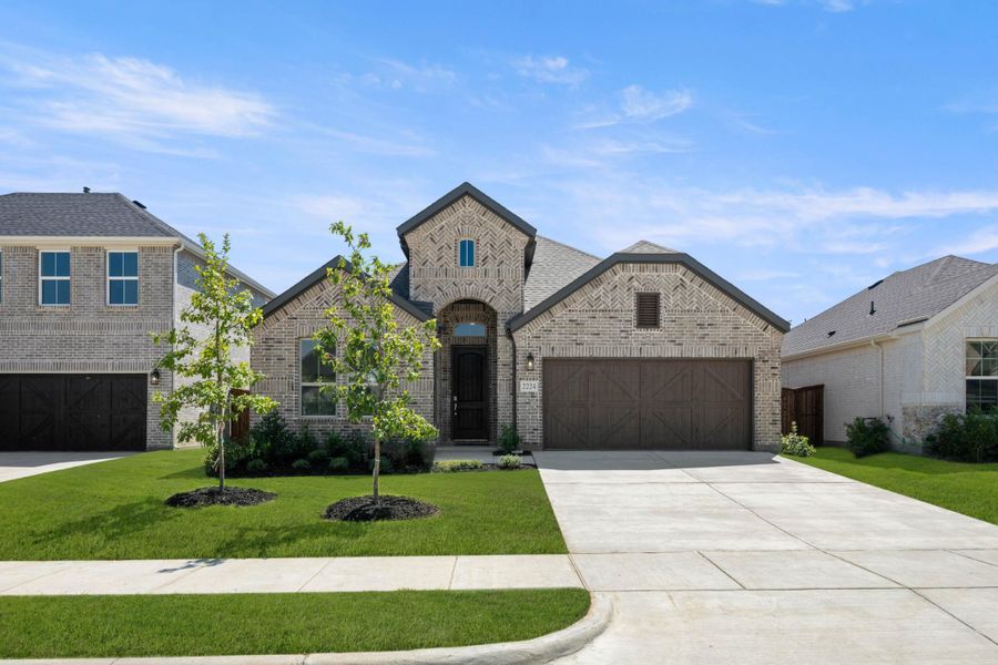 Front exterior of a new home in Discovery Collection at Bridgewater, Midlothian, TX, highlighting curb appeal (Image 1).