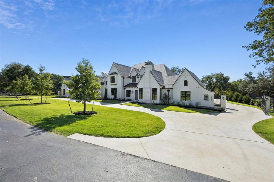 Front exterior of a new home in , Westlake, TX, highlighting curb appeal (Image 1). Front exterior of a new home in , Westlake, TX, highlighting curb appeal (Image 1).