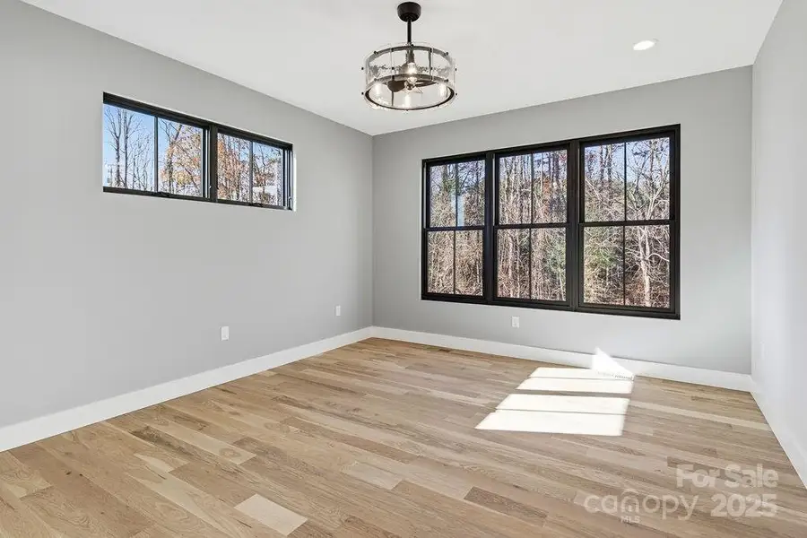 Bright primary suite on main with peaceful mountain views