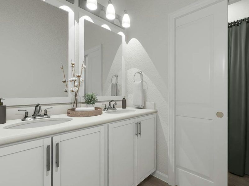 Secondary bedrooms share a dual-vanity hall bath.