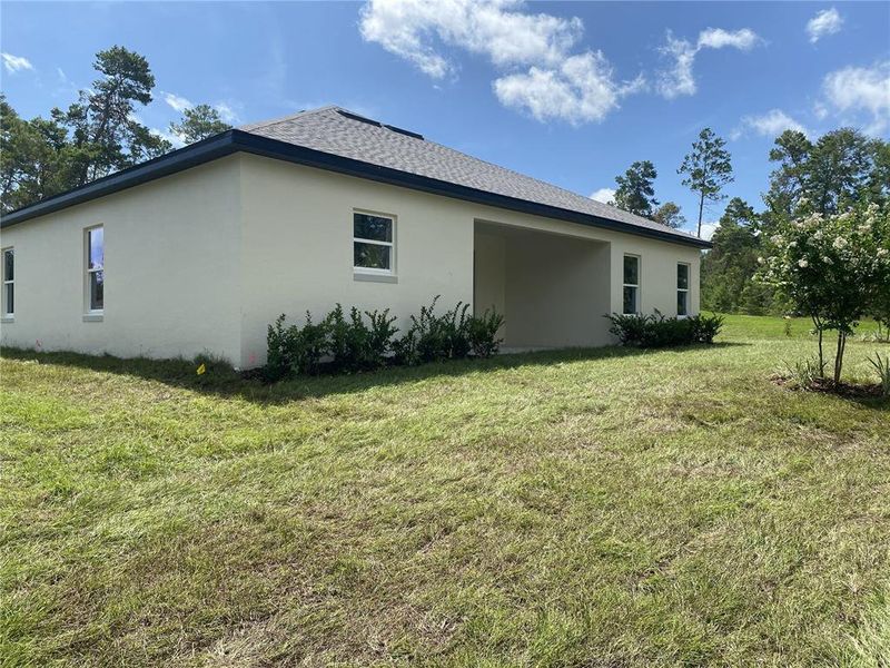 Exterior details and patio area of a home in , Brooksville (Image 3).