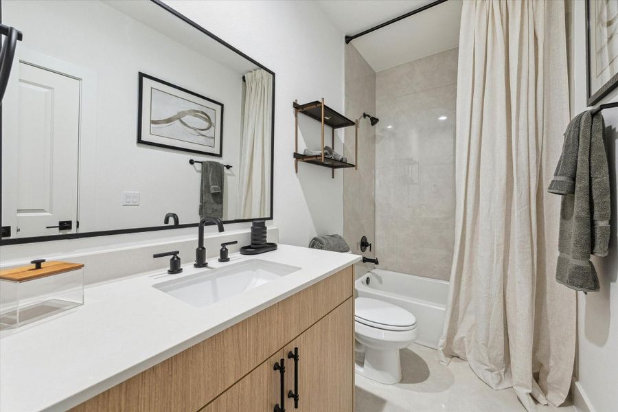 Secondary bathroom with sleek fixtures and clean design Secondary bathroom with sleek fixtures and clean design