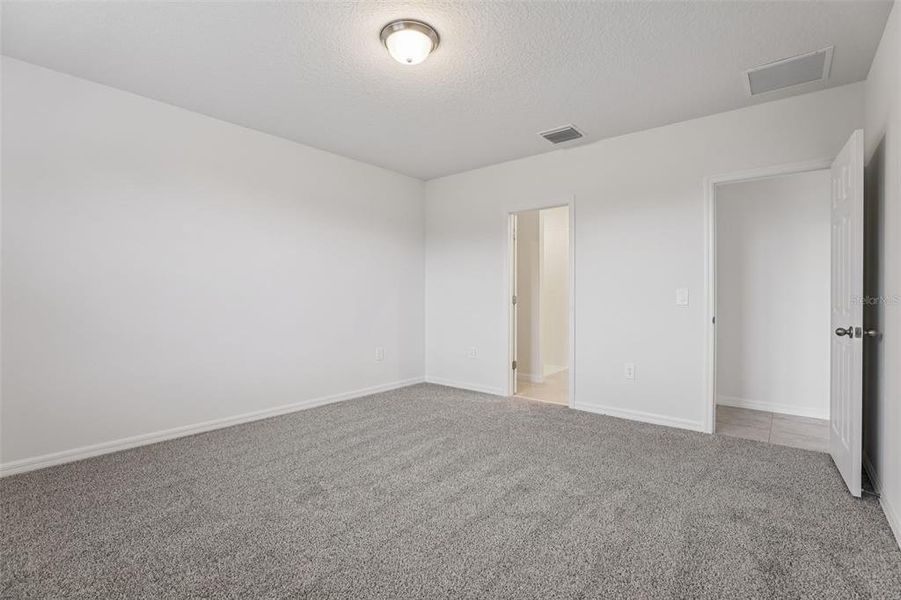 Spacious, unfurnished interior of a new home in Bradbury Creek - Signature Series, Haines City (Image 24).