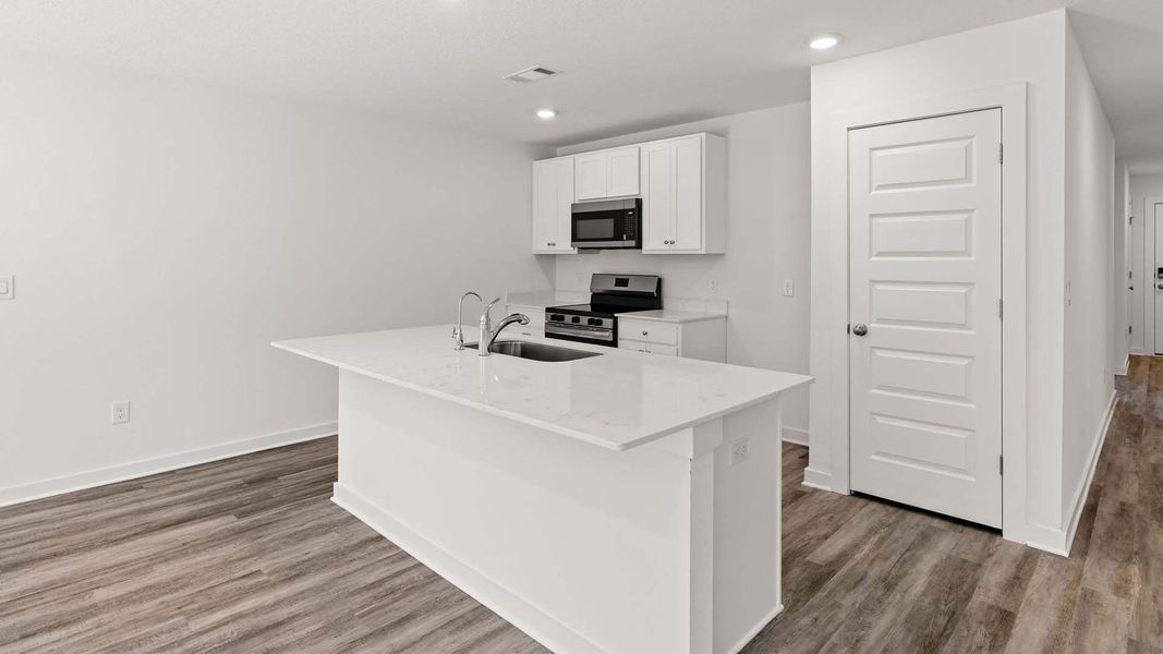 Furnished interior view inside a new home in Magnolia at the Bluffs Phase 3, Freeport (Image 6).