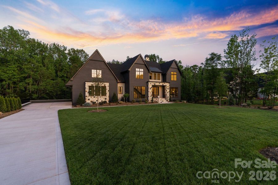 Front exterior of a new home in Cardinal Crest, Weddington, NC, highlighting curb appeal (Image 26). Front exterior of a new home in Cardinal Crest, Weddington, NC, highlighting curb appeal (Image 26).