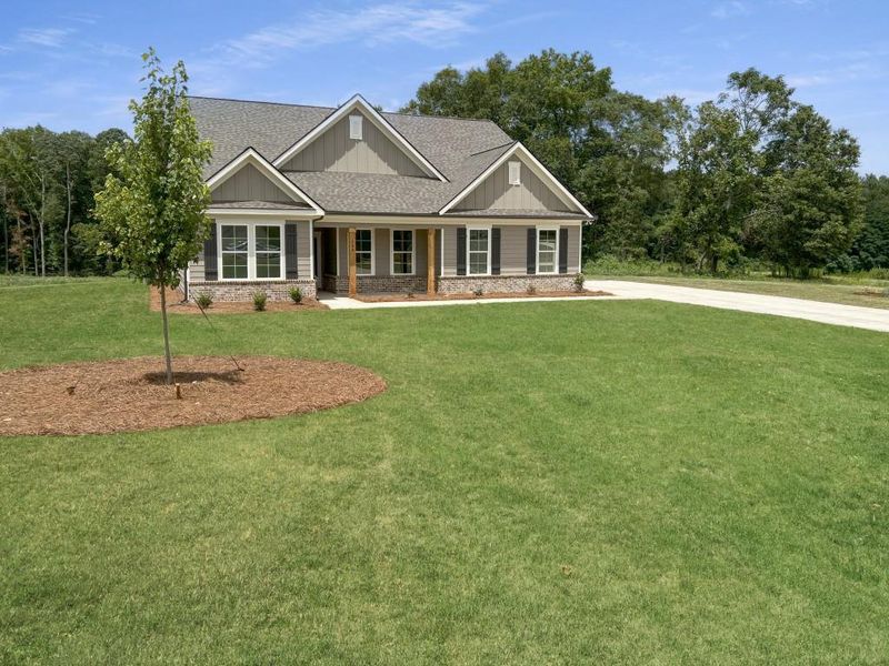 Front exterior of a new home in , Good Hope, GA, highlighting curb appeal (Image 1).