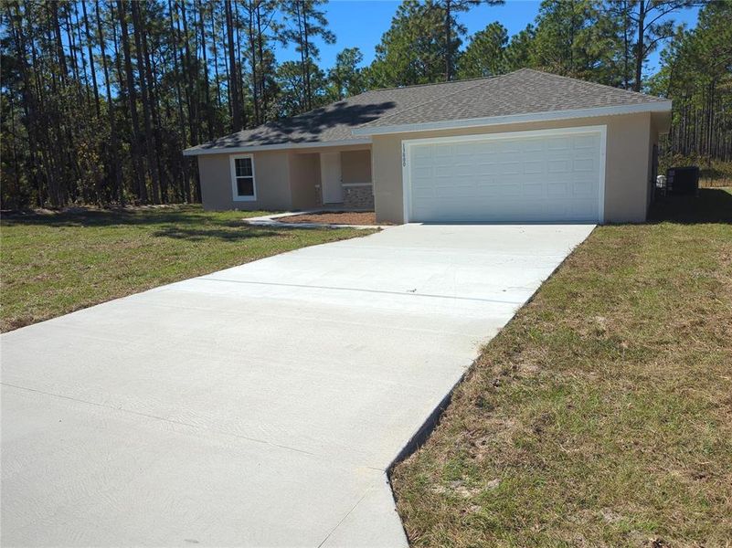 Front exterior of a new home in , Ocala, FL, highlighting curb appeal (Image 19). Front exterior of a new home in , Ocala, FL, highlighting curb appeal (Image 19).
