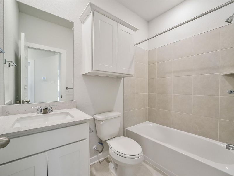 Furnished interior view inside a new home in Caney Creek Place, Conroe (Image 14).