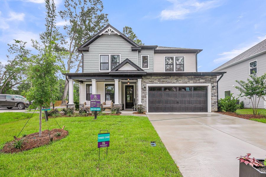 Front exterior of a new home in Indigo Place, North Charleston, SC, highlighting curb appeal (Image 18). Front exterior of a new home in Indigo Place, North Charleston, SC, highlighting curb appeal (Image 18).