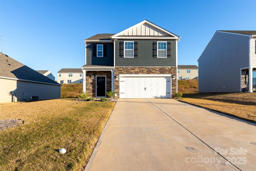 Front exterior of a new home in , Kings Mountain, NC, highlighting curb appeal (Image 1).